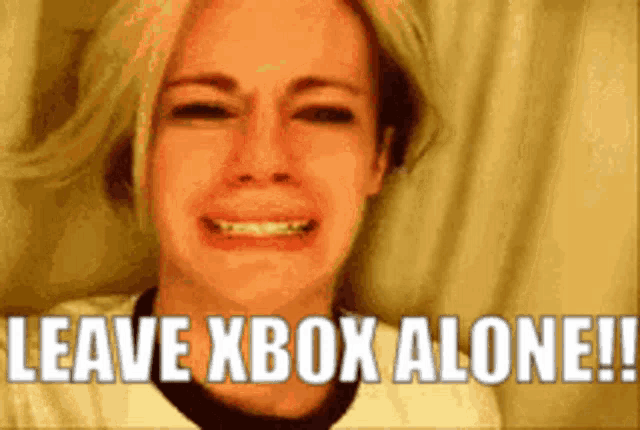a woman is crying with the words " leave xbox alone " behind her