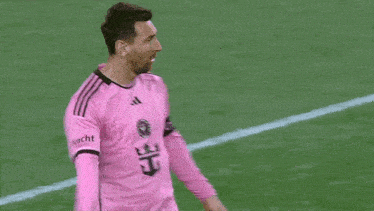 a soccer player wearing a pink jersey that says frachi on the sleeve