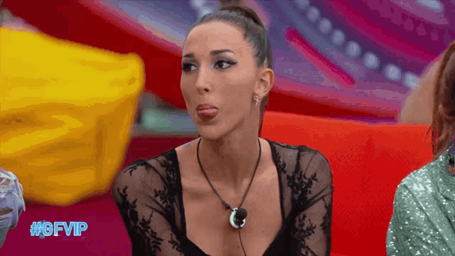 a woman sticking her tongue out with the gfvip logo in the corner