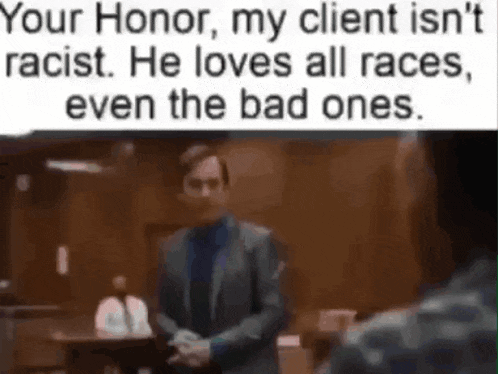 a man in a suit is shaking hands with another man in a courtroom while talking to another man .