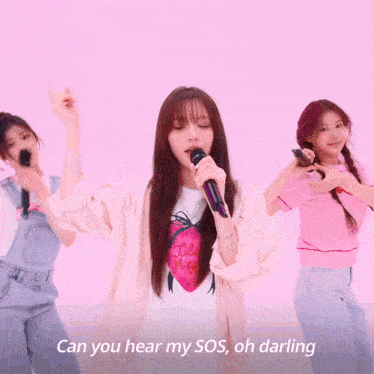 a girl singing into a microphone with the words can you hear my sos oh darling