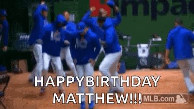 a group of baseball players are dancing on a field while someone says `` happy birthday matthew '' .