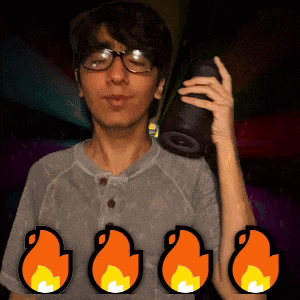 a man wearing glasses is holding a camera in front of four icons of flames