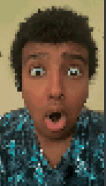 a pixelated image of a person 's face with a surprised look on their face