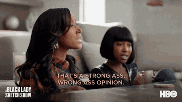 two women are sitting on a couch and one of them is saying that 's a strong ass wrong ass opinion