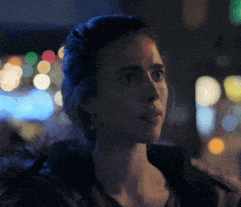 a woman 's face is visible in a blurry photo
