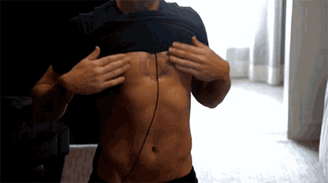 a man has a tattoo on his chest that says " i love you "
