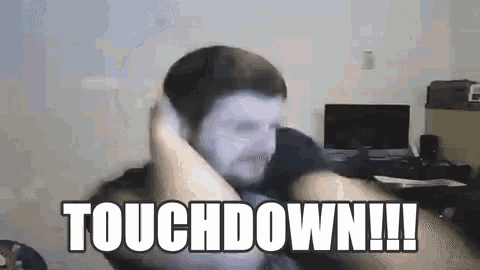 a man is sitting in front of a computer with the words touchdown written on his face