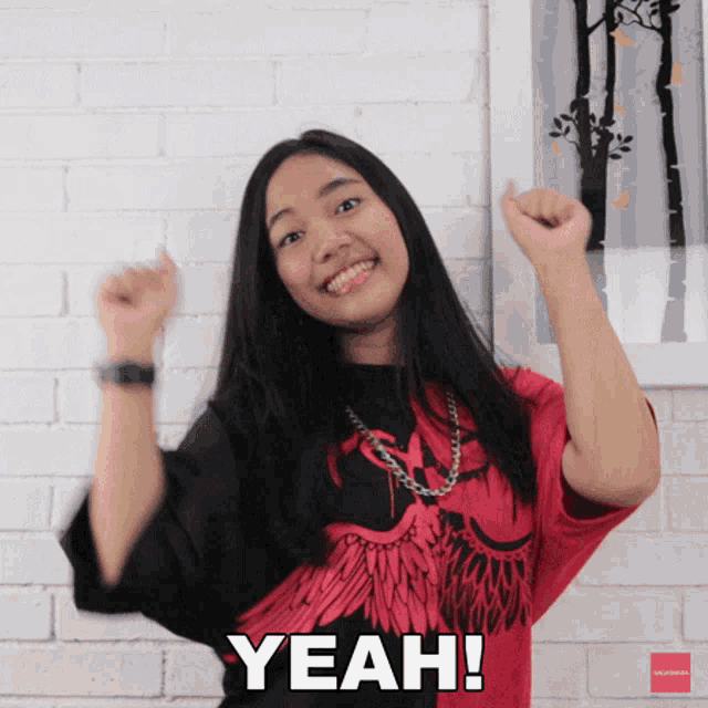 a girl with her arms in the air and the word yeah written on the bottom