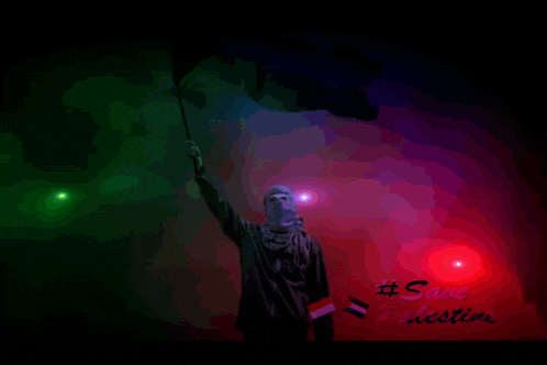 a silhouette of a person holding a flag with #save palestine written on the bottom right