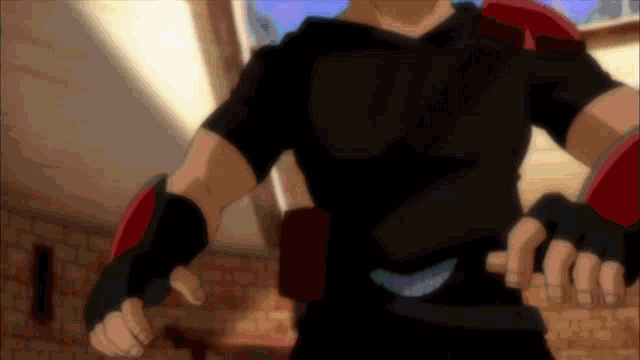 a man in a black shirt is holding a knife in his hand