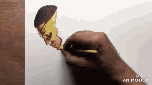 a person is drawing a superhero with a yellow mask on