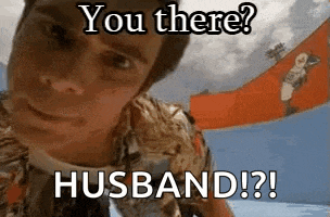 a man in a hawaiian shirt is looking at the camera and says you there ? husband ?
