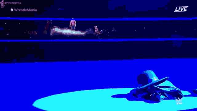a purple lightning bolt is coming out of the ceiling of a stadium .