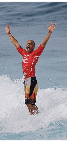 a man in a rip curl shirt is riding a wave in the ocean