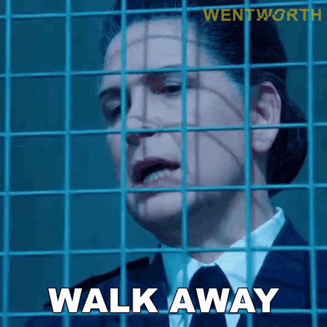 a woman behind bars with the words walk away written on the screen