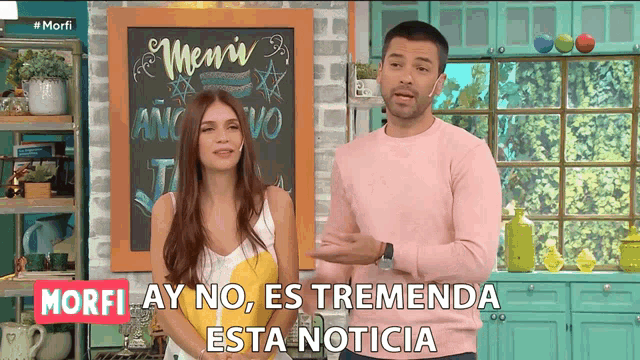 a man and a woman stand in front of a chalkboard that says menu
