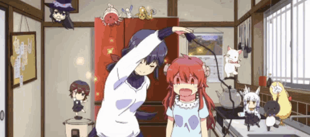 a girl with red hair is standing next to a girl in a kitchen