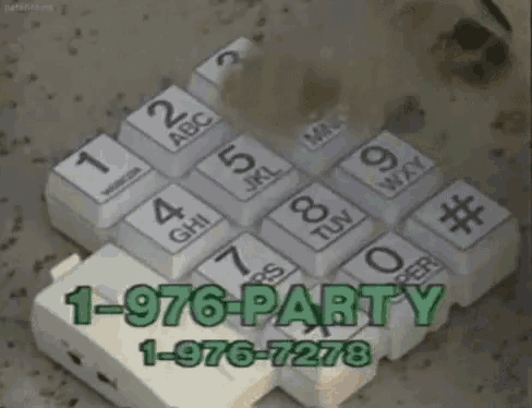 a broken telephone with the number 1-976-7277 on it