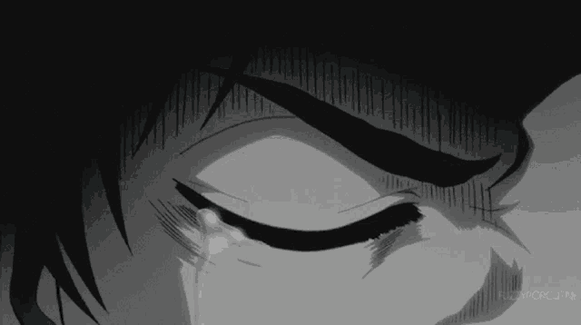 a close up of a person 's face with tears coming out of it