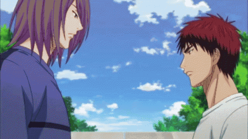 a man with purple hair and a man with red hair are facing each other