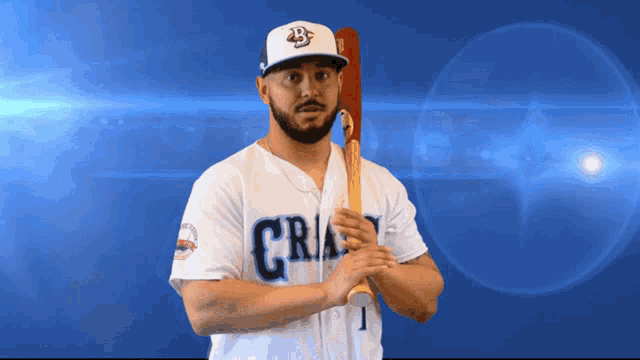 a baseball player holding a bat with the number 1 on his shirt