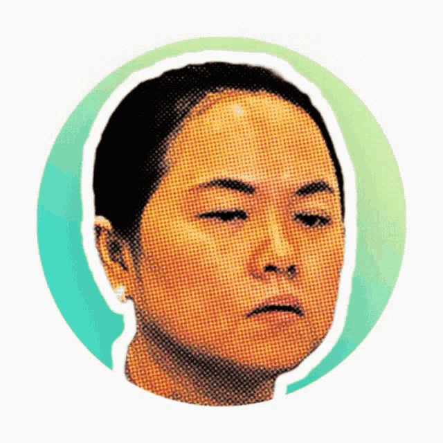 a close up of a woman 's face with a green circle around it