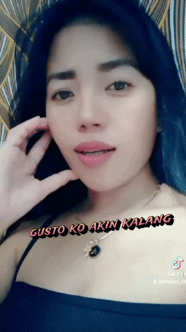 a close up of a woman 's face with the words gusto ko akin walang on it