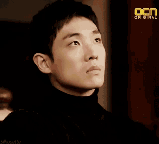 a silhouette of a man with a ocn original logo on the bottom