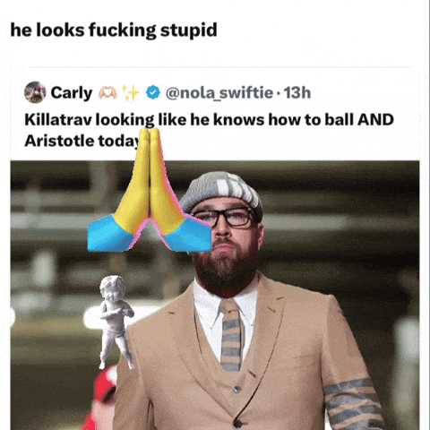 a tweet from carly shows a man in a suit and tie holding a statue