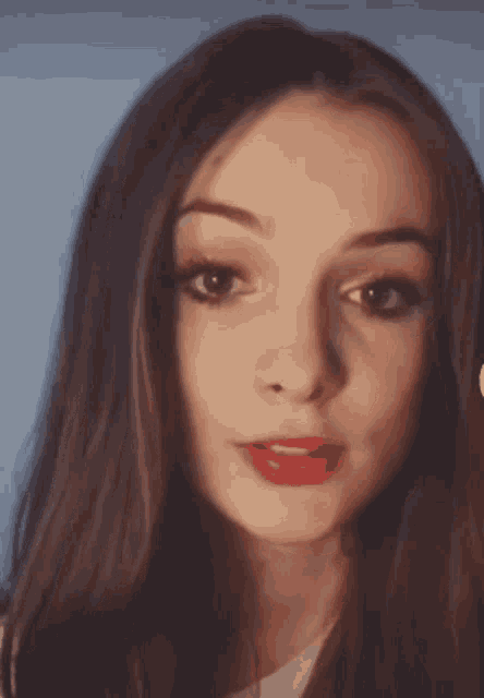 a close up of a woman 's face with long hair