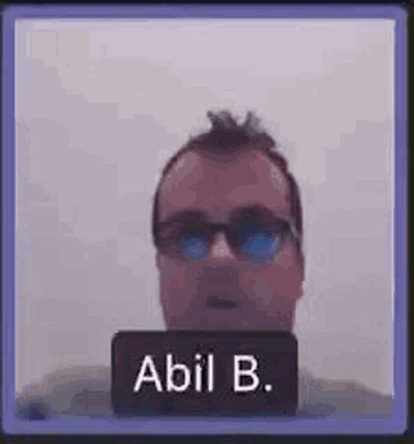 a man wearing sunglasses is on a video call with a name tag that says abil b.