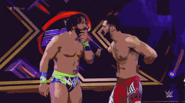 two wrestlers are standing next to each other in front of a wrestling logo that says # 20live