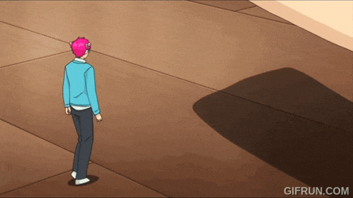 a gif from gifrun.com shows a man with pink hair walking