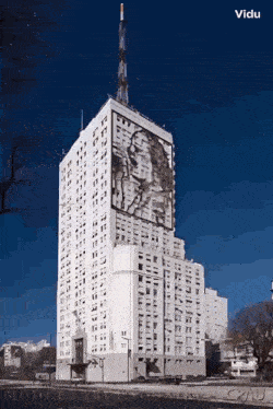 a very tall building with a picture of a man on it