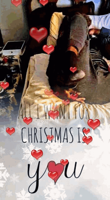 a picture of a person on a bed with the words all i want for christmas is you