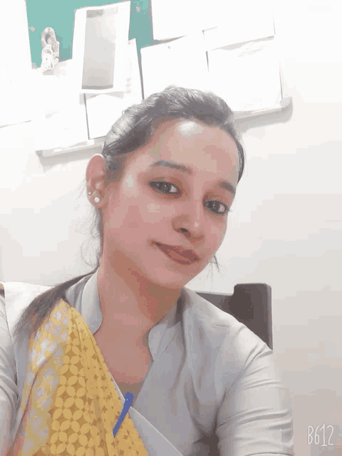 a woman taking a selfie with the hashtag b612 on the bottom