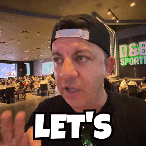 a man wearing a baseball cap says let 's
