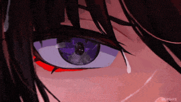 a close up of a person 's eye with a tear coming out