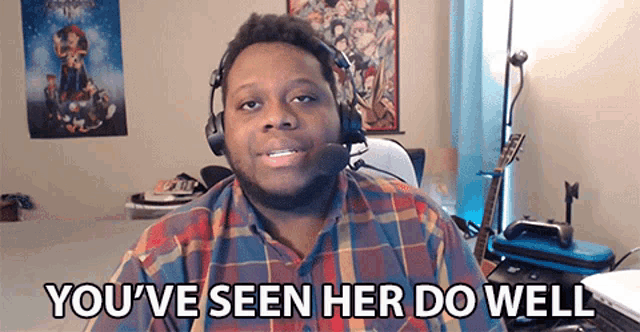 a man wearing headphones and a plaid shirt says you 've seen her do well