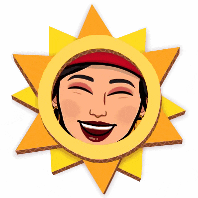 a cardboard sun with a woman 's face in the middle