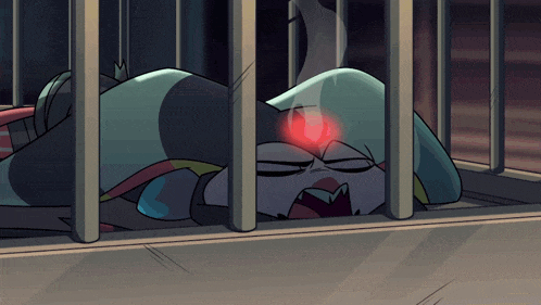 a cartoon character is laying in a jail cell