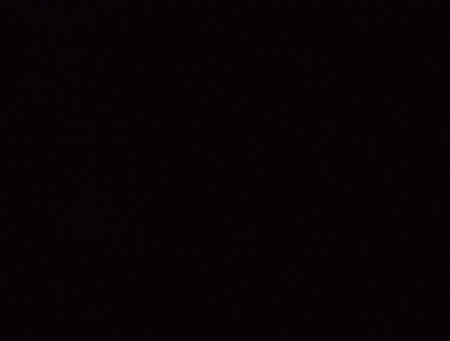 a group of people are standing in a dark room with a lightning bolt behind them
