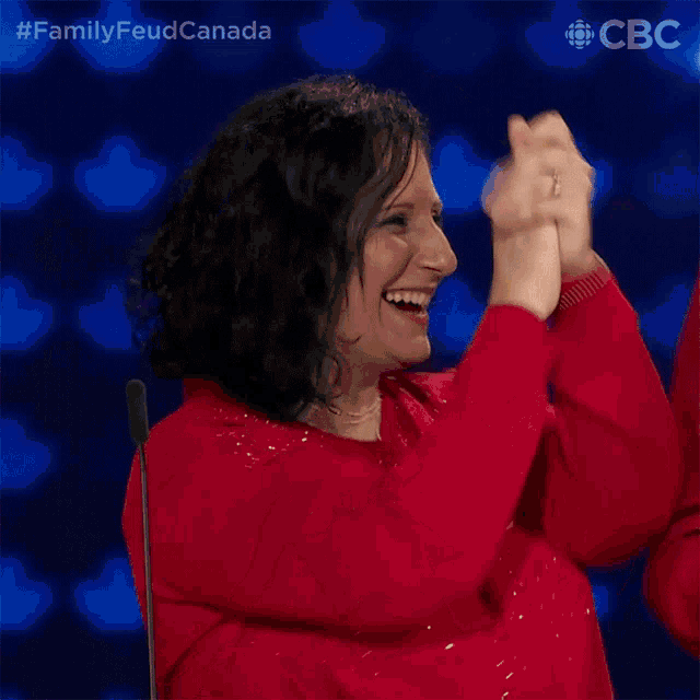 a woman in a red shirt with a name tag that says nancy