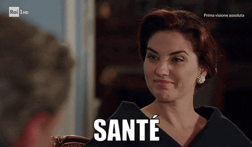 a woman sitting in a chair with the word sante written on her face