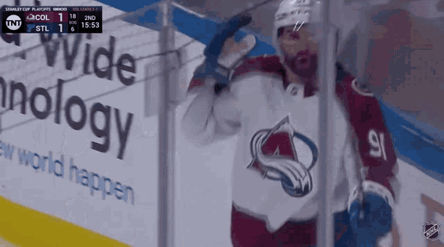 a hockey player with the number 91 on the back of his shirt