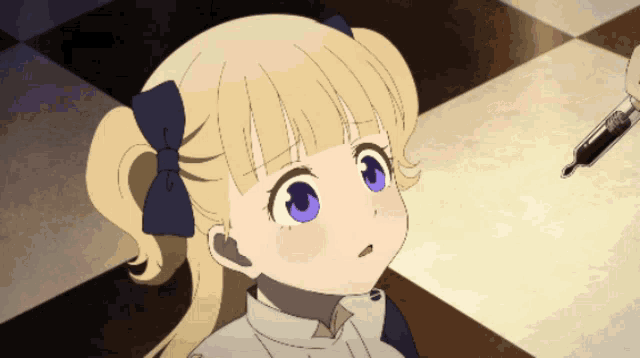 a little girl with blonde hair and blue eyes looks up at a syringe