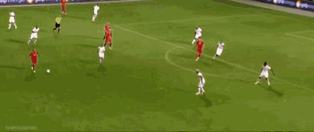 a goalie dives to save a soccer ball in front of an ad for galp energía
