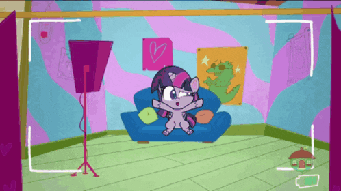 a cartoon of twilight sparkle sitting on a blue couch in a room