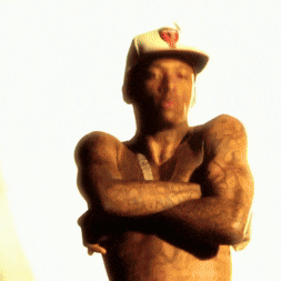 a shirtless man wearing a white hat with a heart on it